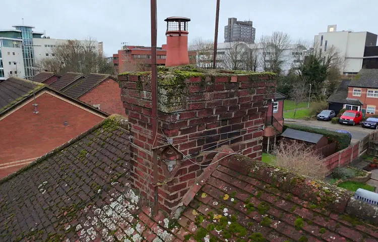 Drone imagery for Level 2 Home Survey showing chimney and roof inspection.